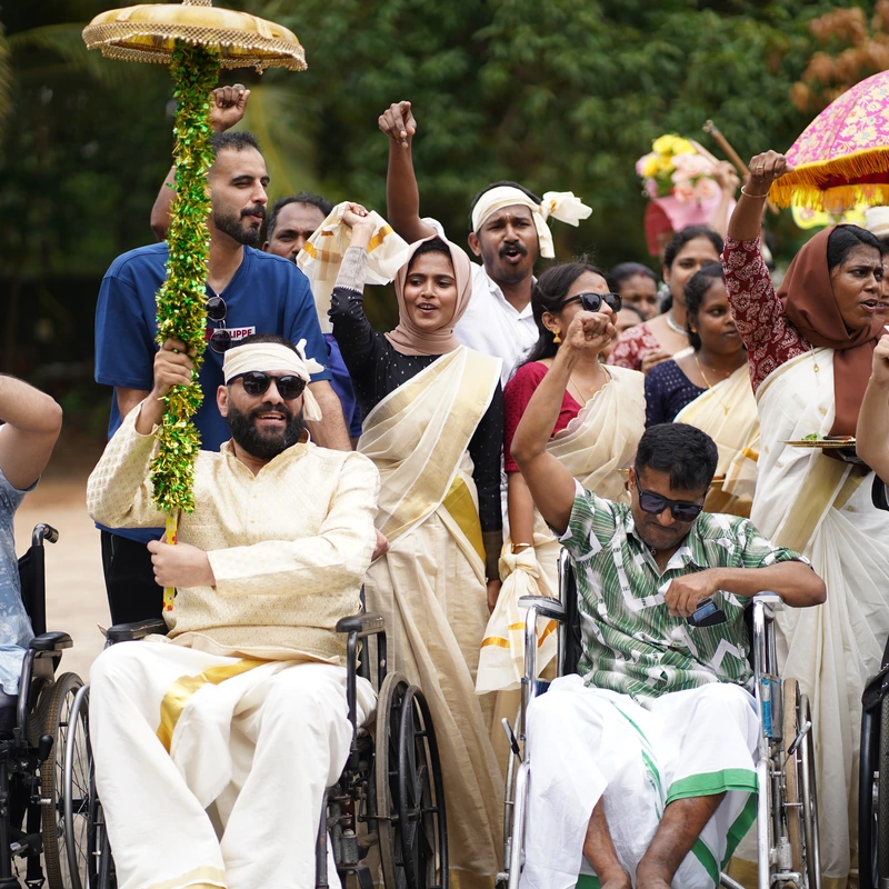 Patients in wheelchairs celebrating Onam festival at Ayurgreen Hospital